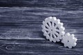 Gears of wood stand on a dark wooden background. Concept of tech Royalty Free Stock Photo