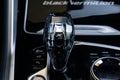 Gearshift knob of a Black Vermillion Edition BMW X6 M Sport with an X symbol