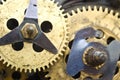 Gearwheels inside clock mechanism.