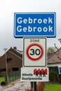 Gebroek, Limburg, The Netherlands - Sign of the village with a speed limit and civil guard warning