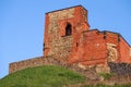 Gediminas' Tower in Vilnius, a part of the back castle part on green hill and blue sky Royalty Free Stock Photo