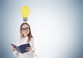 Geek girl and light bulb, gray Royalty Free Stock Photo