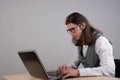 Geek guy is learning new technologies, programming, and computer modeling. Royalty Free Stock Photo