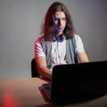 Geek guy is learning new technologies, programming, and computer modeling. Royalty Free Stock Photo