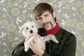 Geek retro man holding dog silly on wallpaper Royalty Free Stock Photo