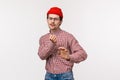 Geeky guy vibing and having fun. Carefree cute funny man in red beanie and glasses, dancing clumsy on dancefloor, enjoy Royalty Free Stock Photo