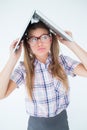 Geeky hipster holding her laptop over her head Royalty Free Stock Photo