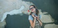 Composite image of geeky hipster woman holding rose Royalty Free Stock Photo