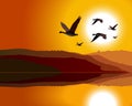 Geese flying through mountain range at sunrise/sun Royalty Free Stock Photo