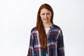 Geez oh my gosh thats disgusting. Redhead teen girl cringe from something bad and awful, grimacing and frowning, staring