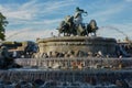 The Gefion Fountain Danish: Gefionspringvandet on the harbor front. It features oxen being driven by the Norse goddess Gefjon.