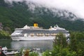 Geiranger, Norway - January 25, 2010: cruise ship in norwegian fjord. Travel destination, tourism. Adventure, discovery, journey. Royalty Free Stock Photo