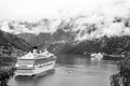 Geiranger, Norway - January 25, 2010: passenger liner docked in port. Cruise ship in norwegian fjord. Travel destination Royalty Free Stock Photo