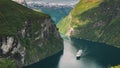 Geirangerfjord, Norway. Touristic Ship Ferry Boat Cruise Ship Liner Floating Near Geiranger In Geirangerfjorden In