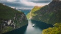 Geirangerfjord, Norway. Touristic Ship Ferry Boat Cruise Ship Liner Floating Near Geiranger In Geirangerfjorden In