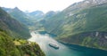 Geirangerfjord, Norway. Touristic Ship Ferry Boat Cruise Ship Liner Floating Near Geiranger In Geirangerfjorden In Sunny