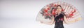 Geisha with giant fan against white background Royalty Free Stock Photo