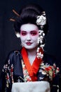 Geisha in kimono on black Royalty Free Stock Photo