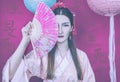 Geisha in a pink kimono and with a fan close-up on a purple background with hieroglyphs and ÃÂhinese lanterns