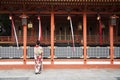 Geishas girl wearing Japanese kimono among red wooden Tori Gate at Fushimi Inari Shrine in Kyoto Royalty Free Stock Photo