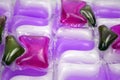 Gel capsules with laundry detergent, close up. Royalty Free Stock Photo