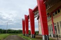 Kutai Barat Indonesia - January 10 2021: This large red sports arena was built environmentally friendly with beautiful nature