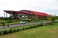 Kutai Barat Indonesia - January 10 2021: This large red sports arena was built environmentally friendly with beautiful nature