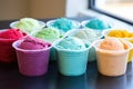 gelato tubs in a variety of vibrant colors