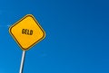 geld - yellow sign with blue sky