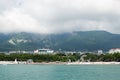 Gelendzhik, Russia people relax on the beach with mountains in the background