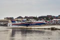 The multipurpose amphibian aircraft Beriev Be-200ES returns to base after demonstration flights over the Black Sea water