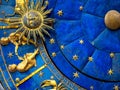 Gemini astrological sign on ancient clock. Detail of Zodiac wheel with Sun and Twins