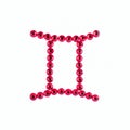 Gemini. Sign of the zodiac of red rhinestones on a white background.