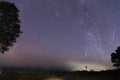 Geminid Meteor Shower and the Milky Way Over a mountain. Geminid Meteor in the night sky