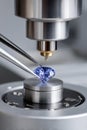 Gemologist analyzing a blue gemstone with precision instruments Royalty Free Stock Photo