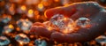 Gems in the hand in close-up against the background of a handful of rough diamonds. Panoramic banner