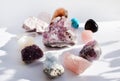 Gems lying on the table. Amethyst, rose quartz, turquoise, citrine, fluorite and other minerals Royalty Free Stock Photo