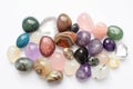 Gems of various colors. Amethyst, rose quartz, agate, apatite, aventurine, olivine, turquoise, aquamarine, rock crystal on white