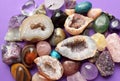 Gems of various colors. Geode amethyst, rose quartz, agate, apatite, aventurine, olivine, turquoise, aquamarine, rock crystal on Royalty Free Stock Photo