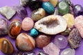Gems of various colors. Geode amethyst, rose quartz, agate, apatite, aventurine, olivine, turquoise, aquamarine, rock crystal on Royalty Free Stock Photo