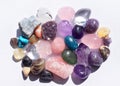 Gems of various colors. Geode amethyst, rose quartz, agate, apatite, aventurine, olivine, turquoise, aquamarine, rock crystal on Royalty Free Stock Photo