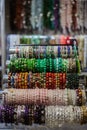 Gemstone bracelets and necklaces in a row. Jewelry made of blue agate crystal, mountain quartz, red coral stones, tiger