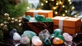 Gemstone Healing Crystal Christmas Gifts. Many Healing Crystals and gift box with Christmas decor. Authentic Gemstones and Royalty Free Stock Photo