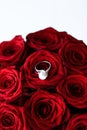 Beautiful white gold pearl ring and bouquet of red roses, luxury jewelry love gift on Valentines Day and romantic holidays Royalty Free Stock Photo
