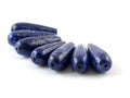 Gemstone natural lapis lazuli on white background, beads Royalty Free Stock Photo