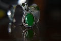 Gemstones jewelery Is a white gold pendant necklace. Set with diamonds and Green jade, rare, Royalty Free Stock Photo