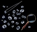 Gemstones, loupe and tweezers on black background. Gem identifying and evaluating process