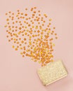 Gemstones spilling out of a golden purse