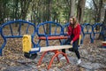 Gen z, generation z, Zoomers device addiction, digital detox. Teenager girl alone rides on a swing in an autumn park