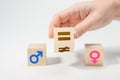 Gender equality concept on wooden cubes. Concepts of gender equality. Hand flip wooden cube with symbol unequal change to equal